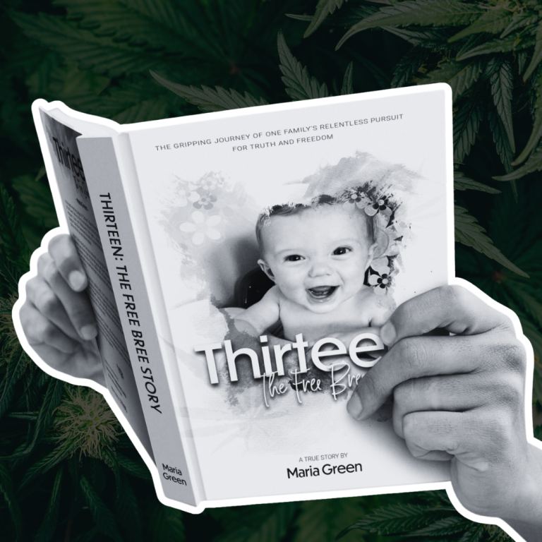 A person is holding a book titled Thirteen The Free by Maria Green with a monochrome image of a baby on the cover, surrounded by cannabis leaves.