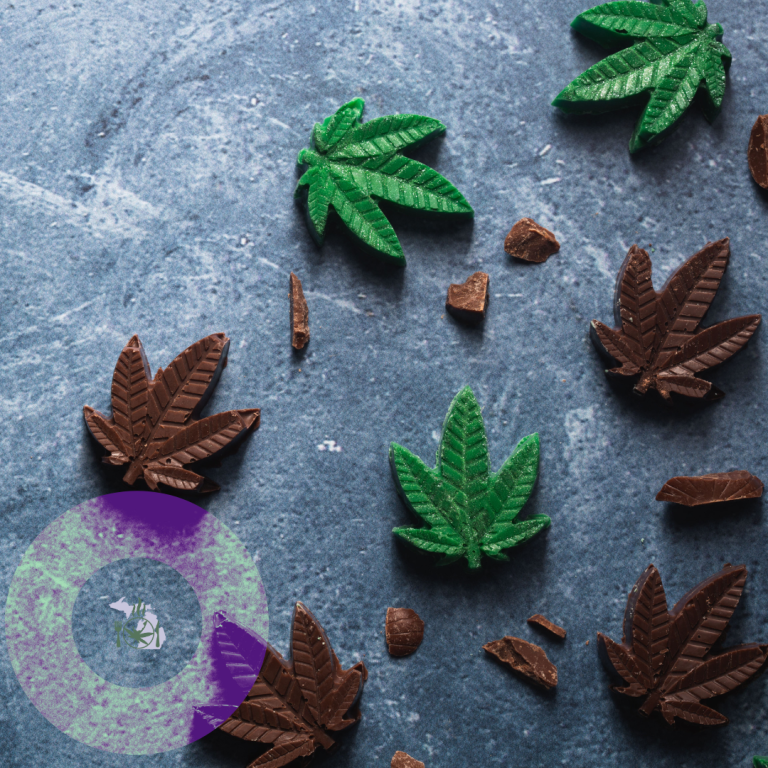 The image shows chocolate cannabis leaves scattered on a textured surface, suggesting an edible marijuana-themed confectionery.